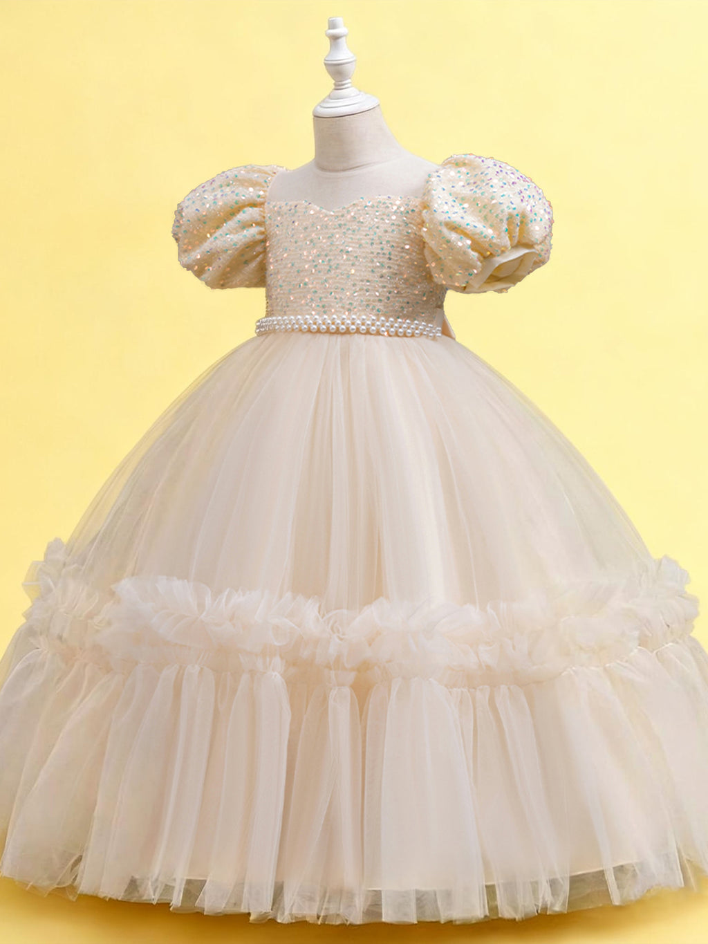 Blisseven champagne girls party dress angled view showing the puff sleeves and ruffled tulle skirt
