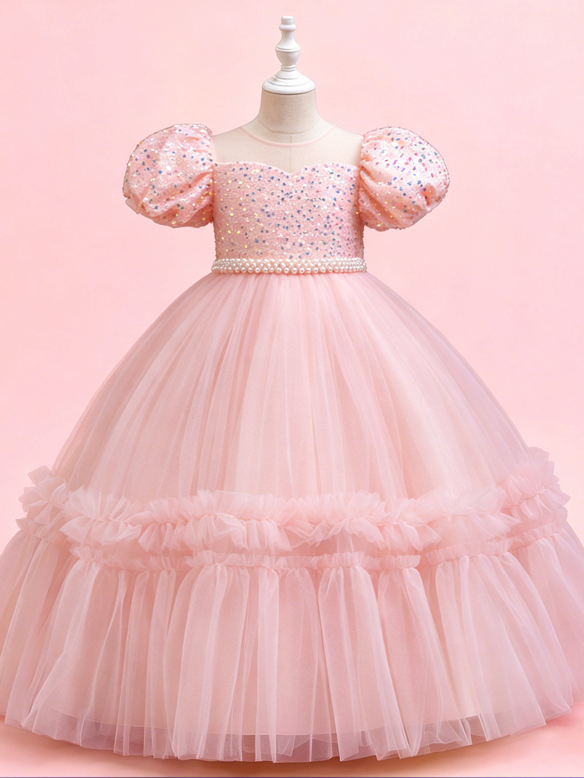 Blisseven pink girls party dress angled view showing the puff sleeves and ruffled tulle skirt