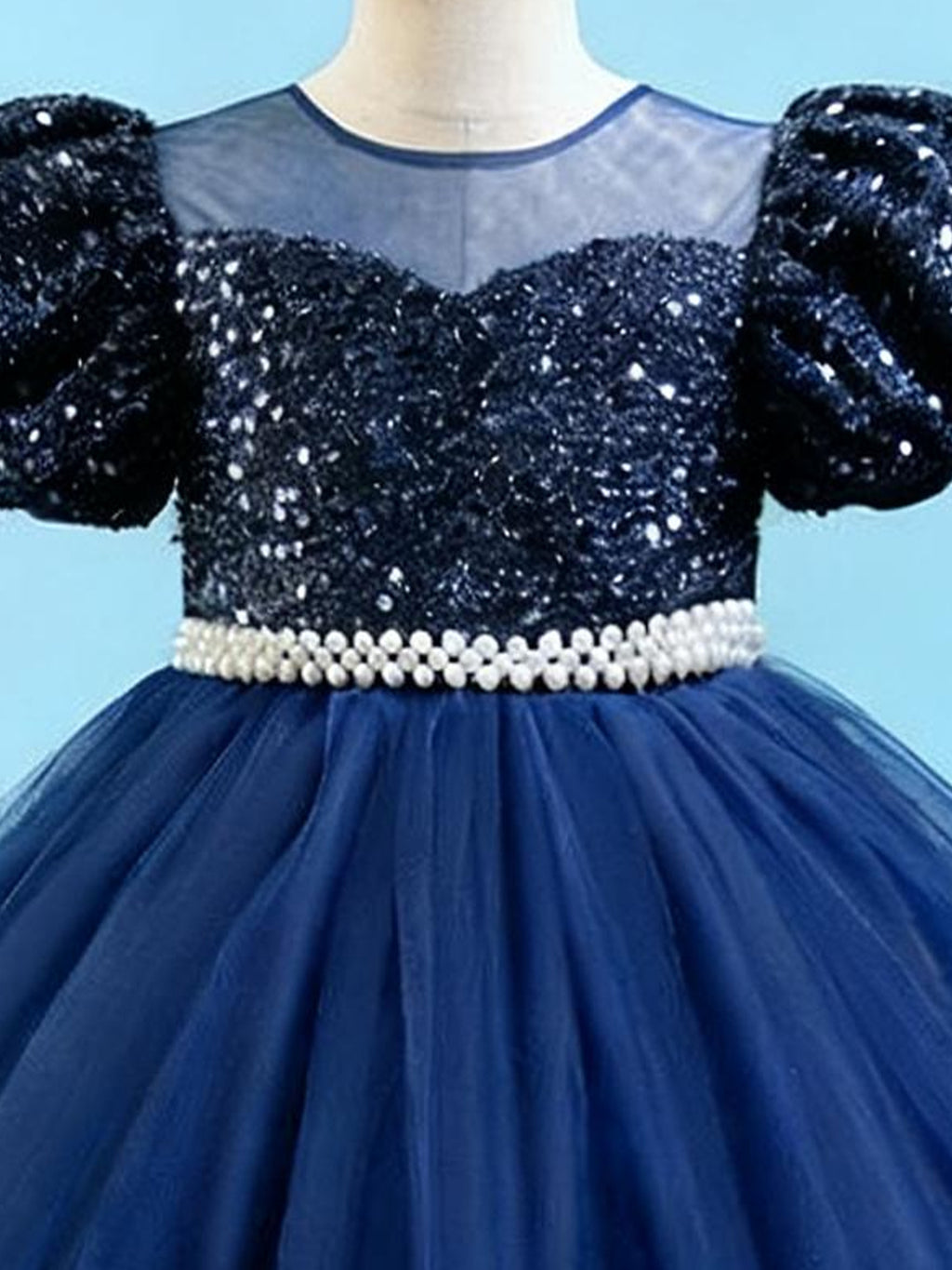 Blisseven sky blue girls party dress close-up of the sequin bodice and decorative waist trim