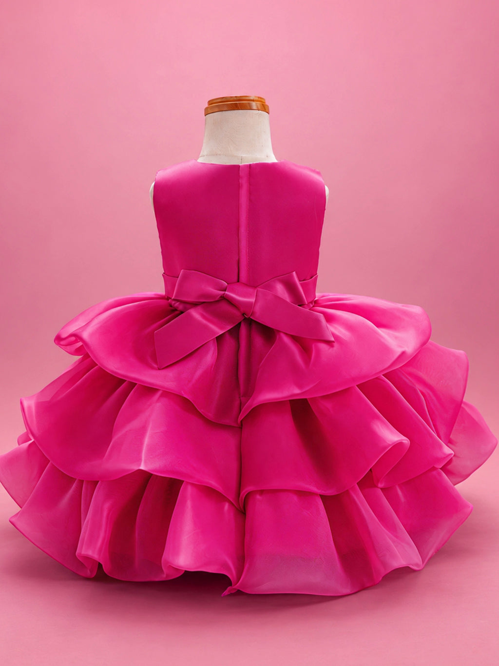 Blisseven LS8609 hot pink girls organza tiered short princess dress back view, featuring a smooth satin bodice, back bow, zipper closure, and layered organza skirt
