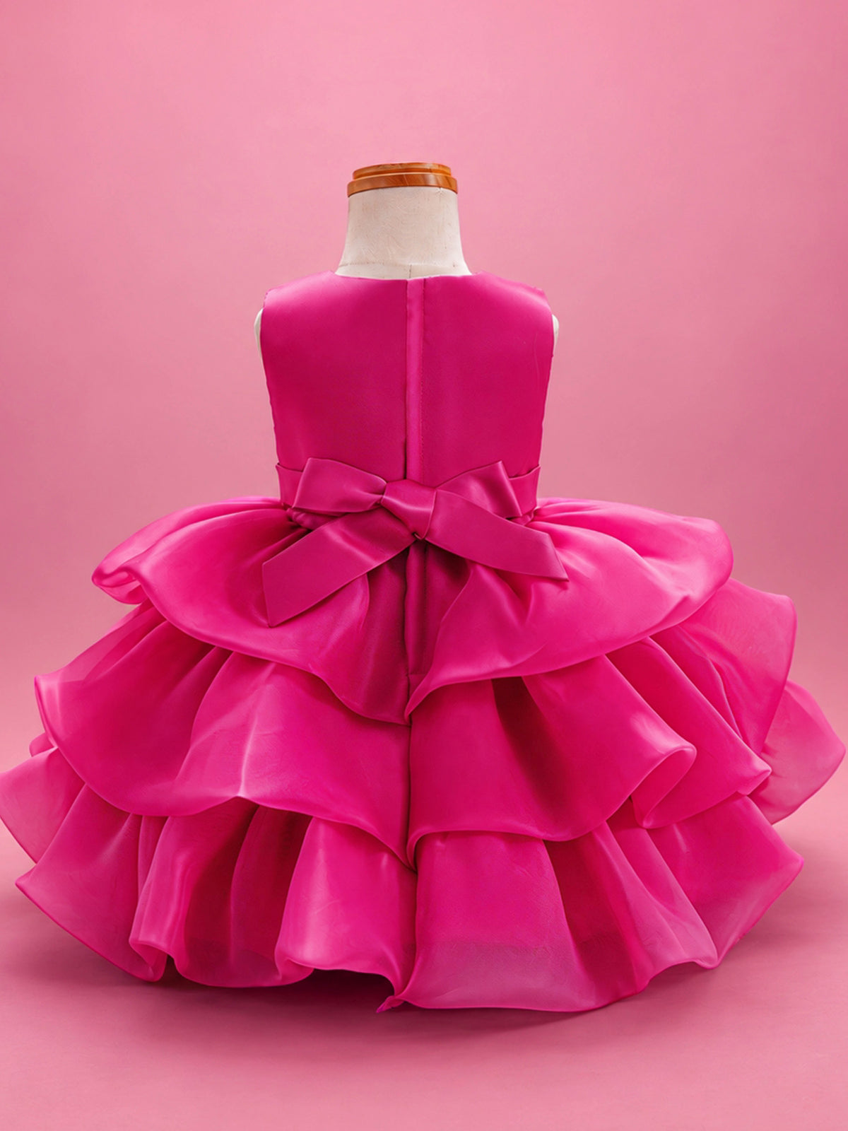 Blisseven LS8609 hot pink girls organza tiered short princess dress back view, featuring a smooth satin bodice, back bow, zipper closure, and layered organza skirt