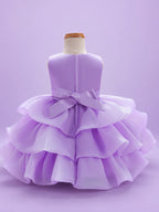 Blisseven LS8609 lavender girls organza tiered short princess dress back view, featuring a smooth satin bodice, back bow, zipper closure, and layered organza skirt