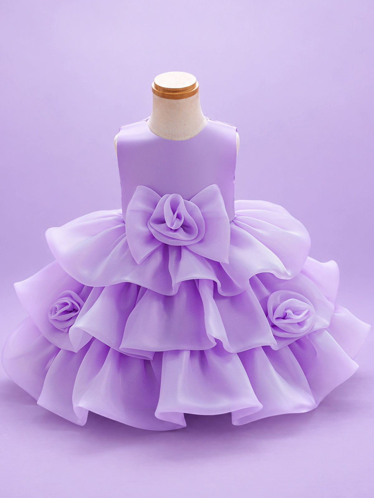 Blisseven LS8609 lavender girls organza tiered short princess dress front view, featuring a fluffy layered skirt, large 3D floral bow at the waist, and small flower details on the skirt