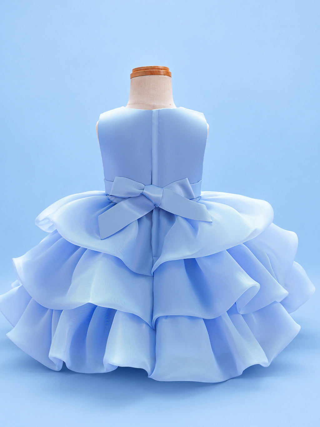 Blisseven LS8609 sky blue girls organza tiered short princess dress back view, featuring a smooth satin bodice, back bow, zipper closure, and layered organza skirt