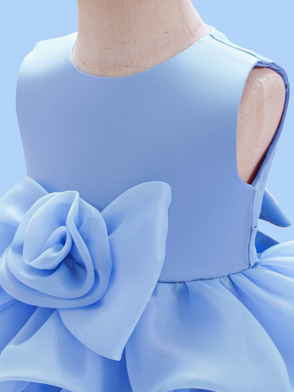 Blisseven LS8609 sky blue girls princess dress bodice detail, showing the smooth sleeveless bodice, waist seam, and large 3D floral decoration