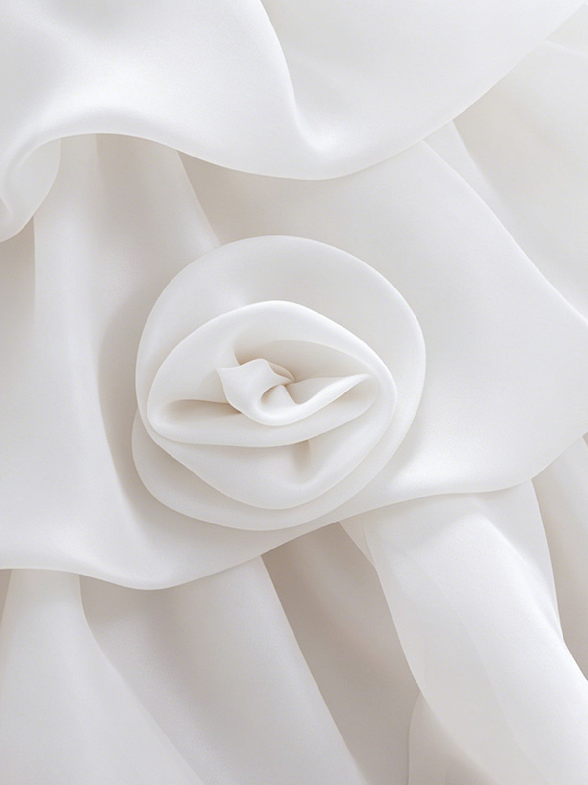 Blisseven LS8609 white girls organza dress skirt flower detail, showing small 3D floral decorations on the layered tiered skirt