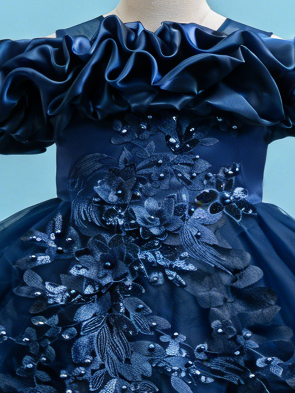Blisseven navy blue princess dress close up with 3D floral ruffle neckline