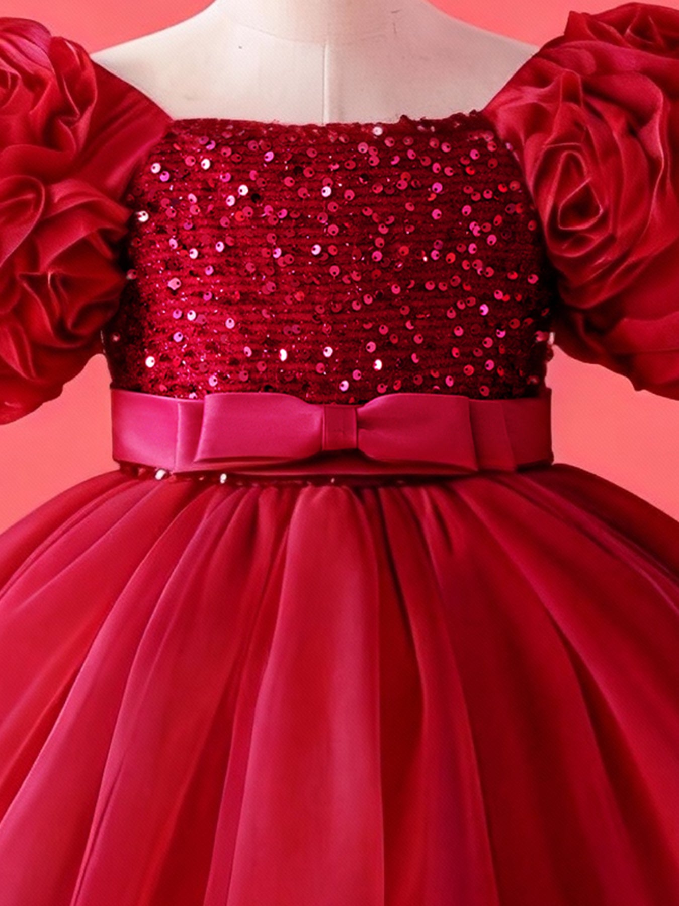 Close up of burgundy 3D floral sleeves on girls princess dress