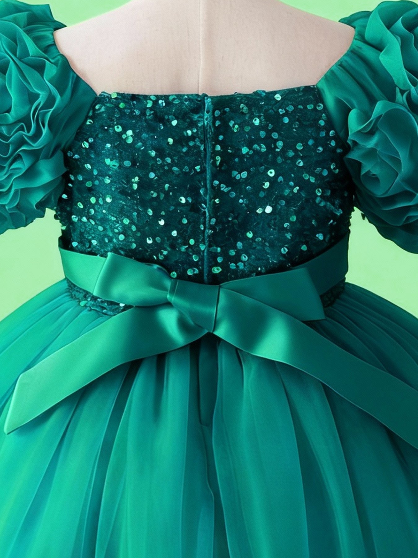 Emerald green sequin bodice and bow waist detail on girls princess dress