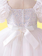Close up of white 3D floral sleeves on girls princess dress