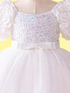White layered tulle hem with 3D floral details on girls party dress